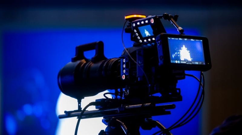 Alt text: A professional video camera set up in a production studio for business content