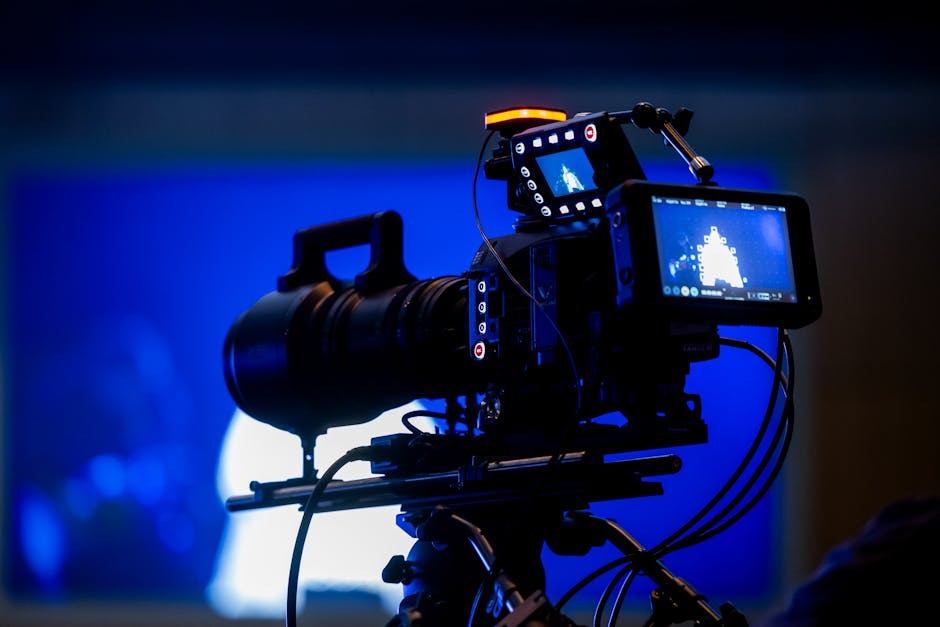 Alt text: A professional video camera set up in a production studio for business content